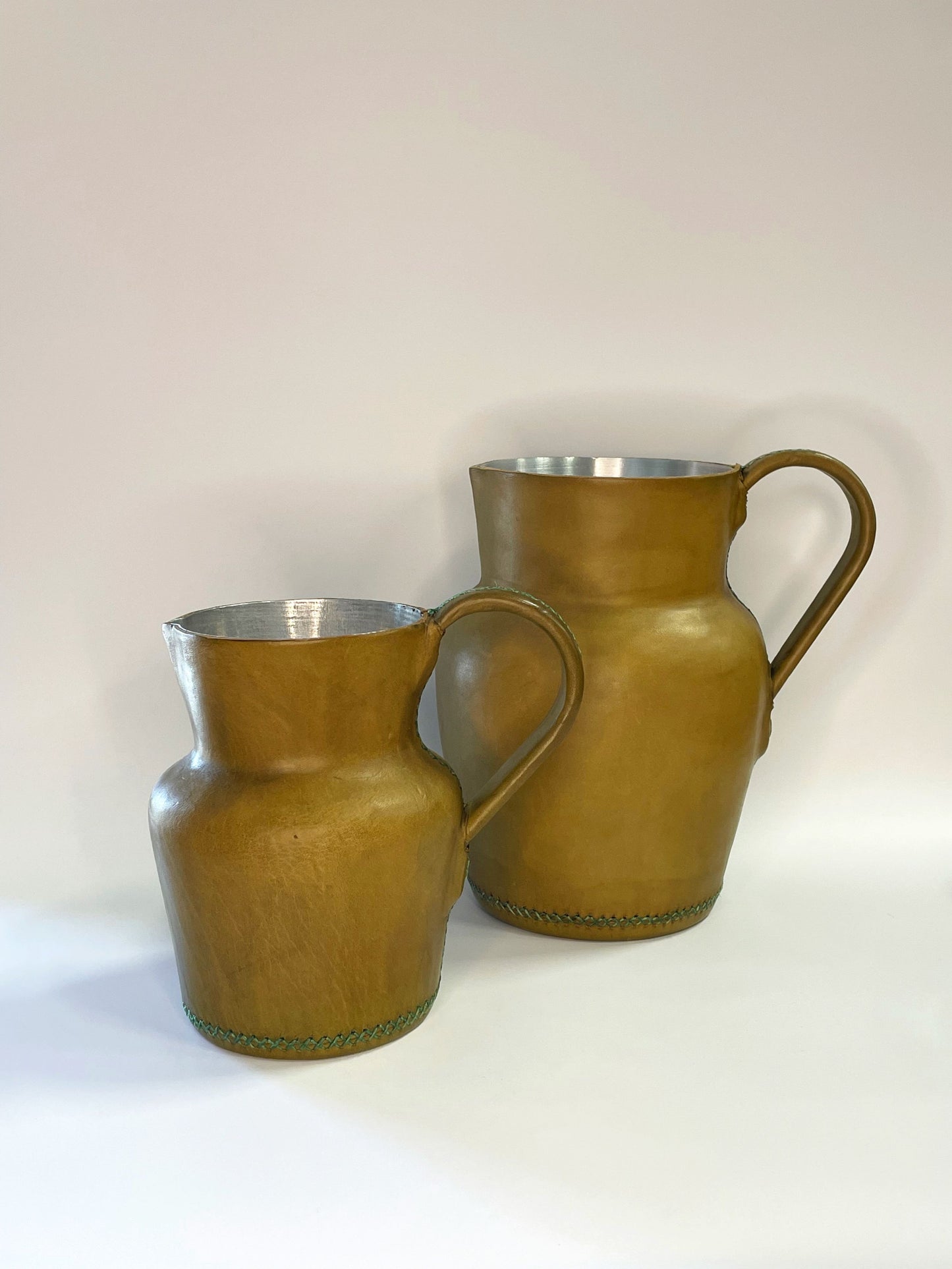 6" and 8" leather wrapped lime carafes