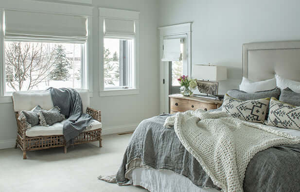 Elegant bedroom with vaulted ceilings and modern light fixture