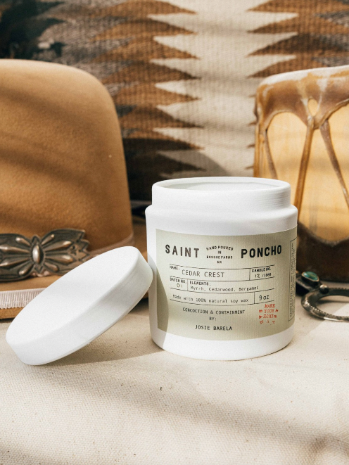 Saint Poncho cedar crest candle with hat and drum in background