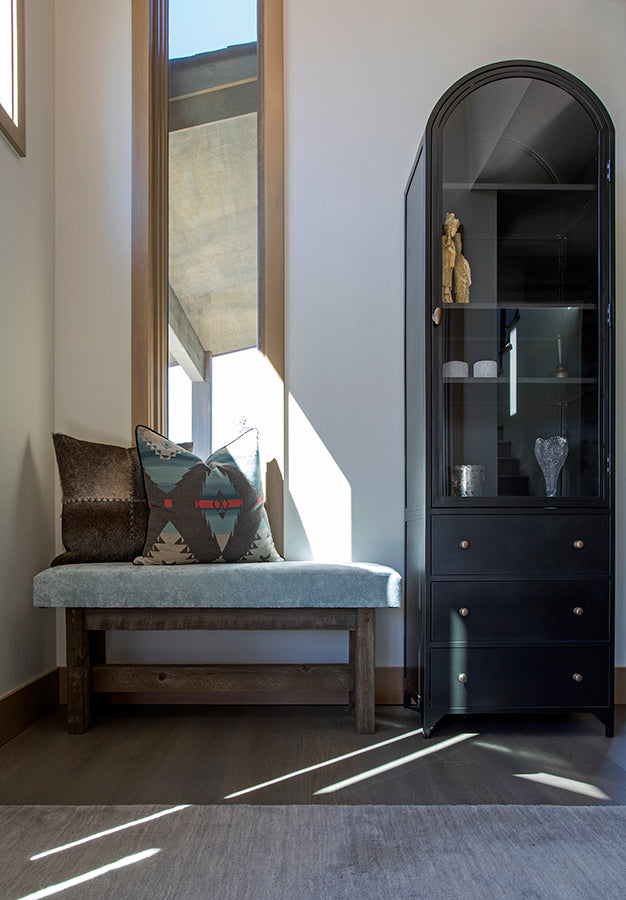 Foyer with upholstered bench, mirror and armoire