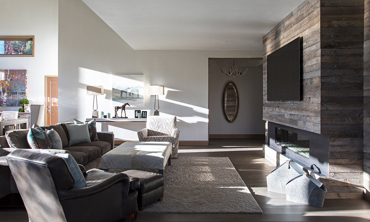 Modern living room with mounted tv over fireplace