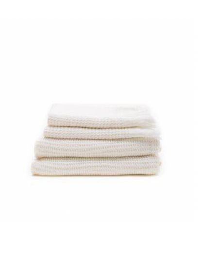 Stack of white ella waffle bath towels