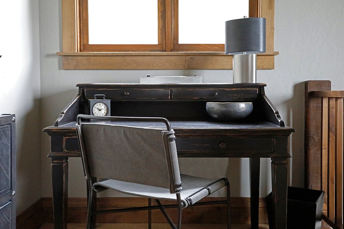 Antique desk in front of window