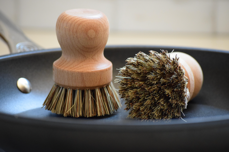 Pot and pan brush in pan