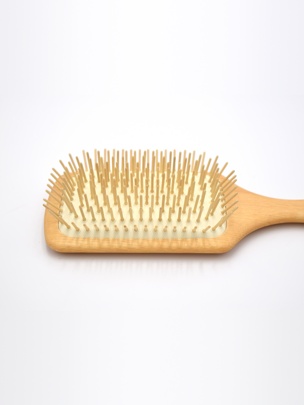 Wooden paddle brush bristles