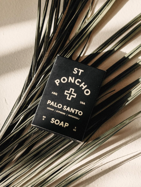 Saint Poncho Palo Santo hand soap bar on a palm leaf