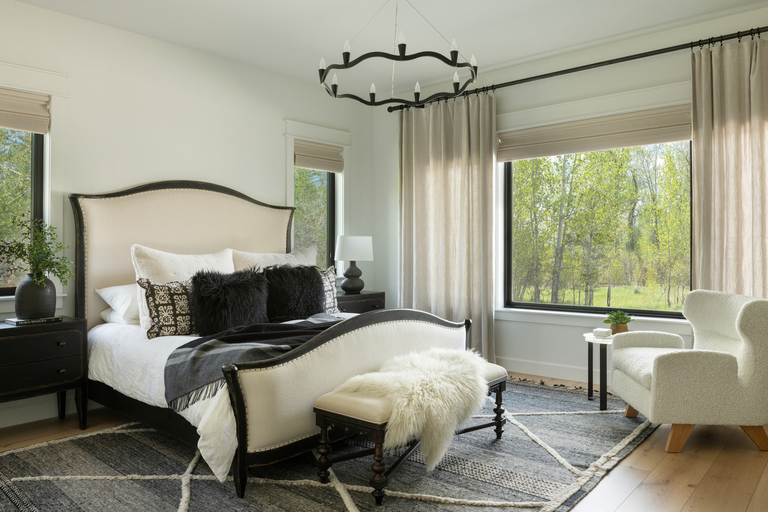 Transitional bedroom with traditional bed frame and large picture frame windows