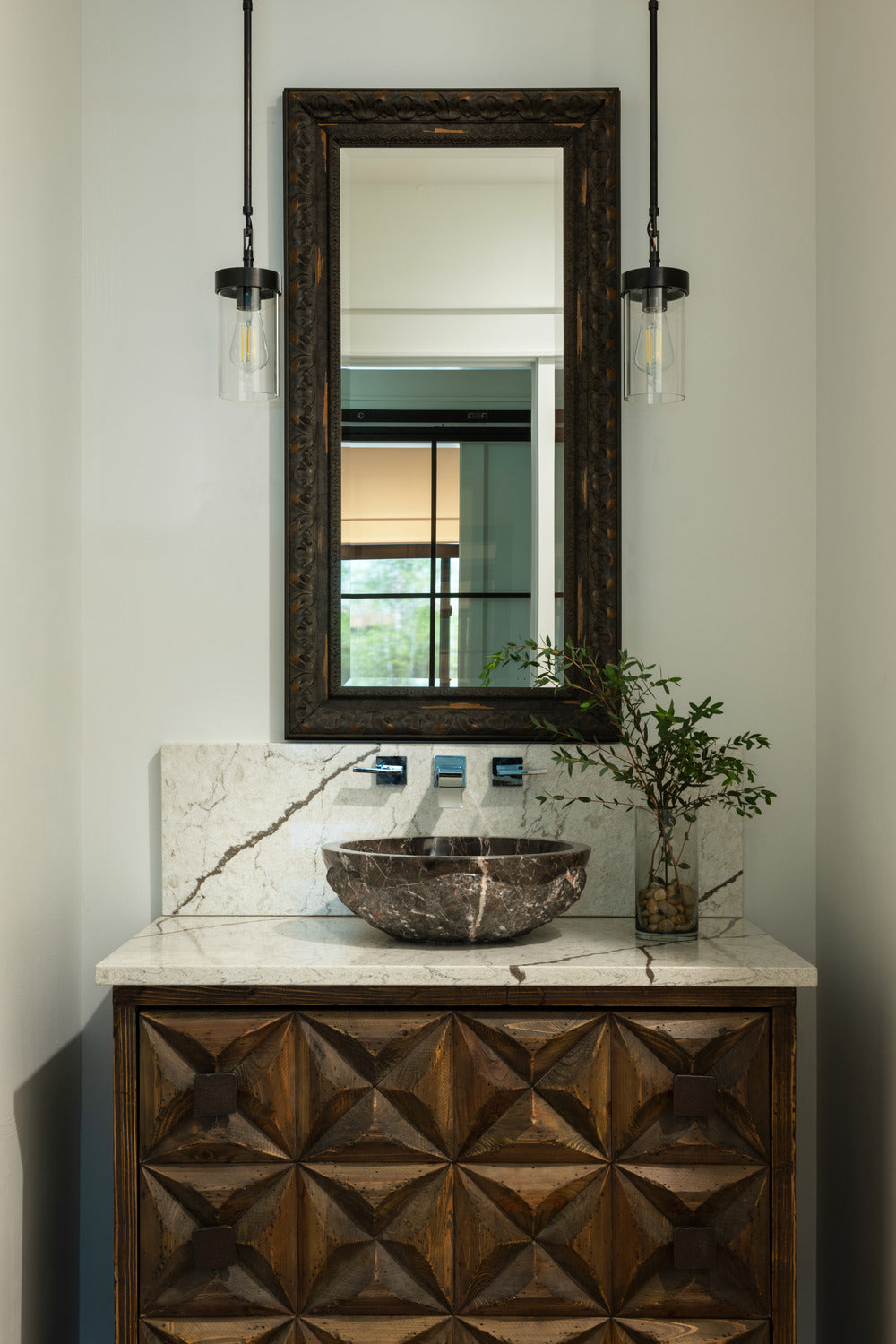 Transitional bathroom with wooden ornate vanity and basin sink