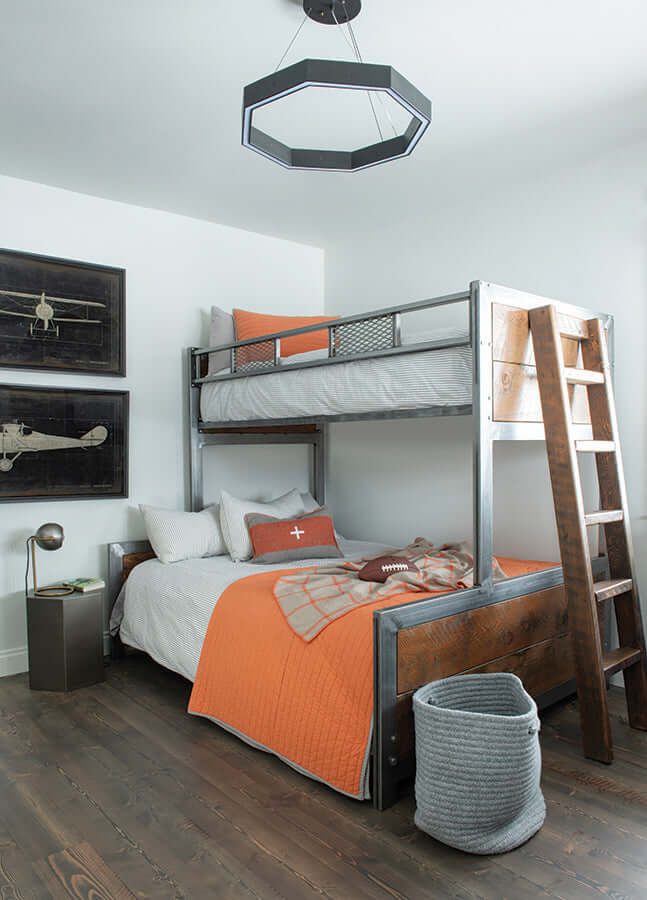 Bedroom with modern bunk beds, wall art, and angular light fixture