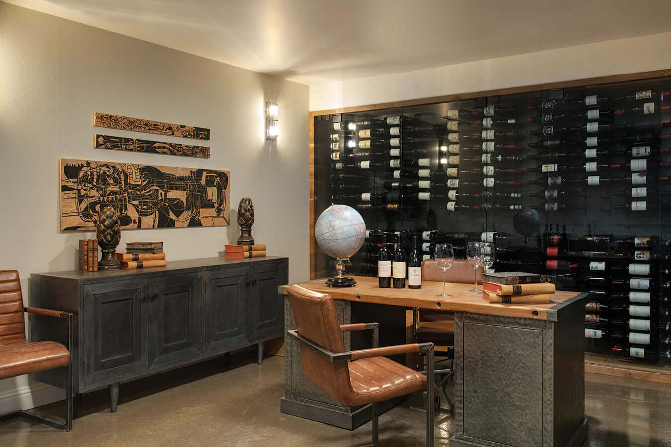 Elegant wine cellar with wall-sized wine rack, desk, and wall art