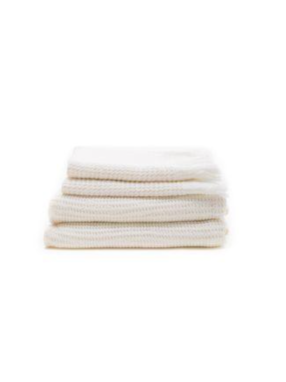 Stack of white ella waffle bath towels