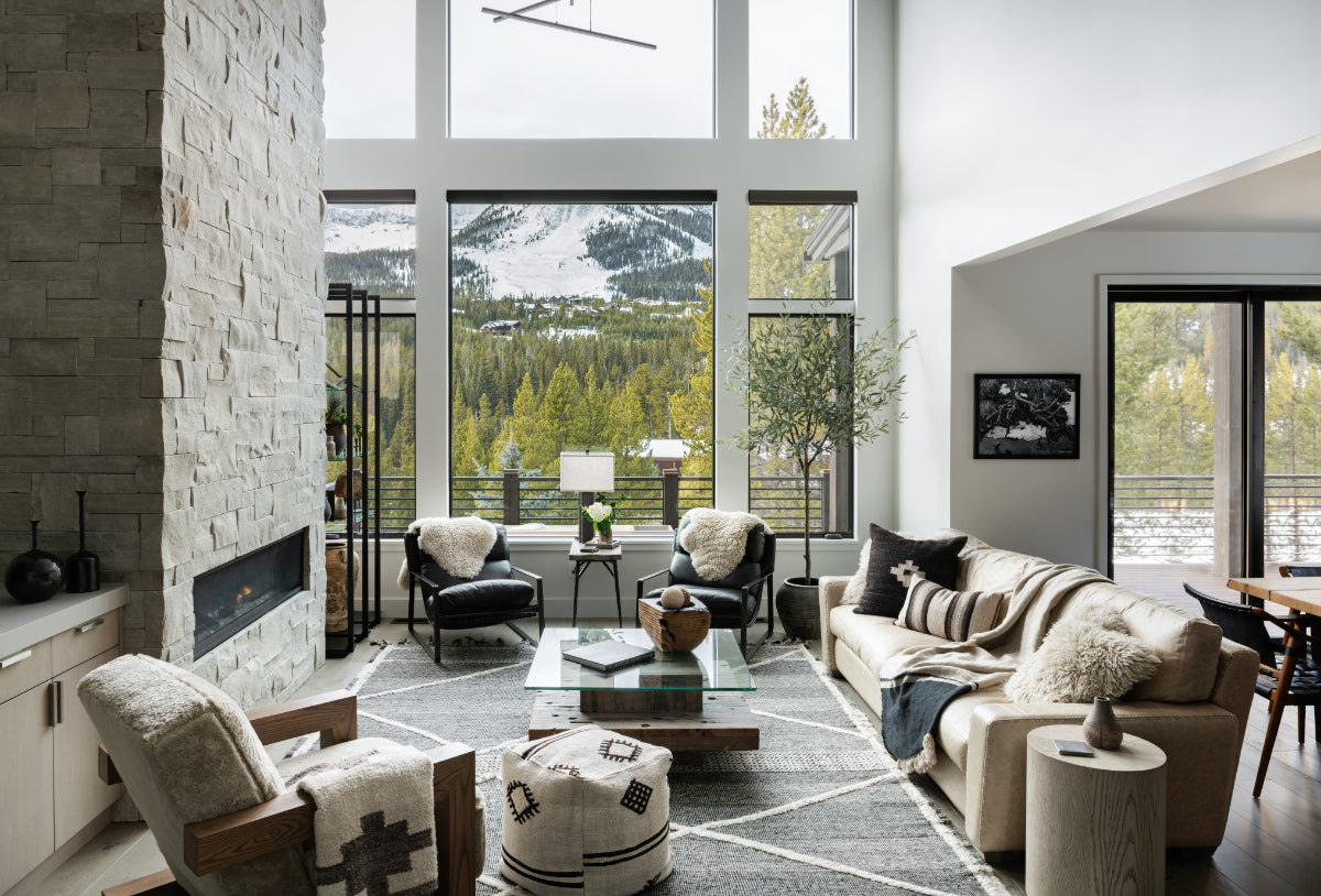 Living room with fireplace and mountain view