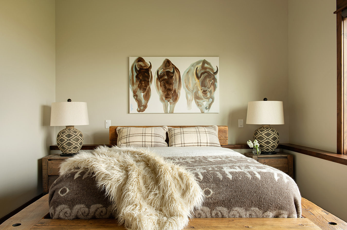 Rustic bedroom set with bison painting on the wall