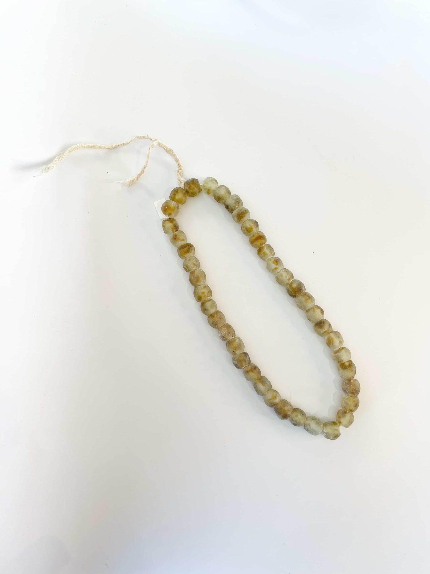 Recycled glass beads in ochre