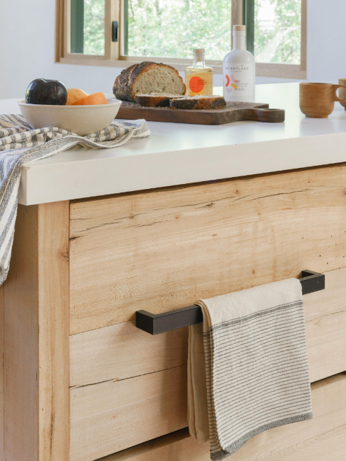 Stone hand towel hanging on cabinet