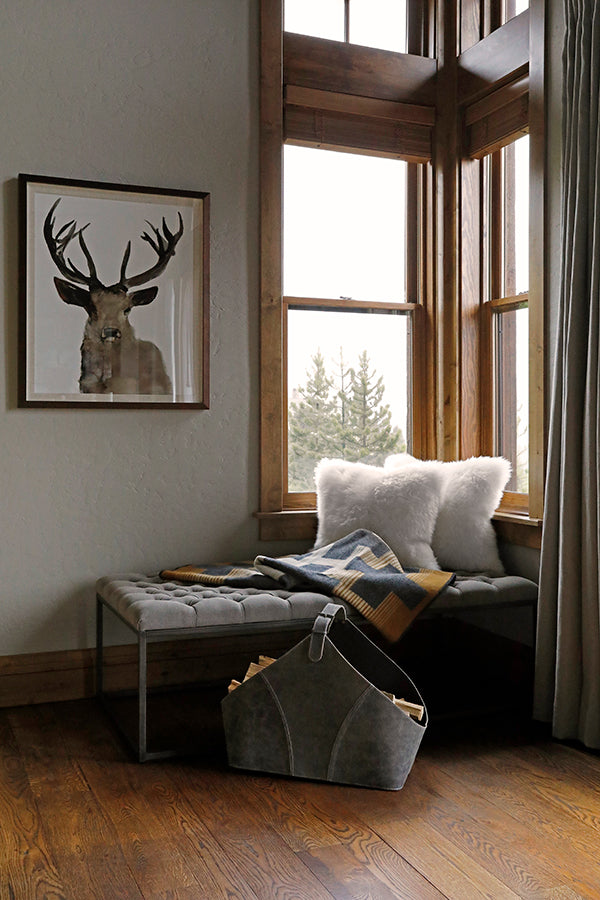Sitting nook with corner window and mule deer artwork